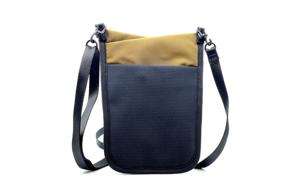 The rear of the P.I.K.A. Pouch in Coyote (light brown) 210 Ballistic.